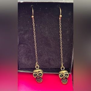 New never been used long skull earrings